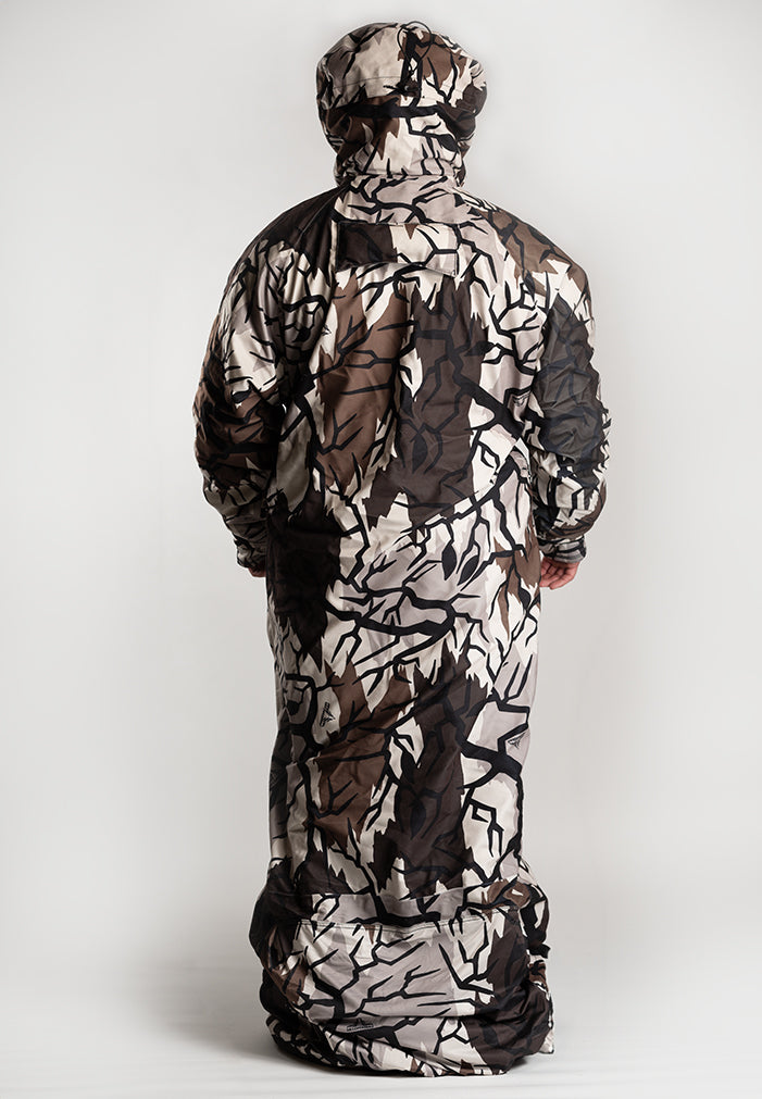 Bow hunter drawing a bow while wearing the IWOM HeatLoc Pro Extreme
