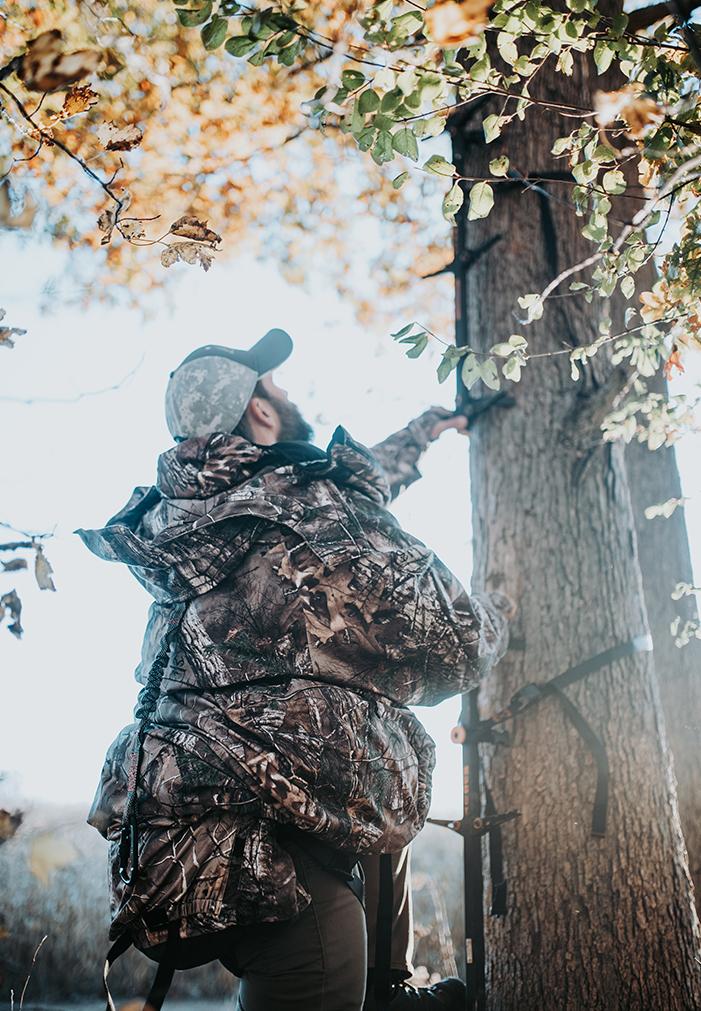 IWOM Hunting Suit in Realtree camo | Jacket mode with safety harness tether slot. Climbing sticks