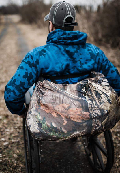 IWOM Pursuit XT Adaptive Hunting Jacket rolled up on wheelchair